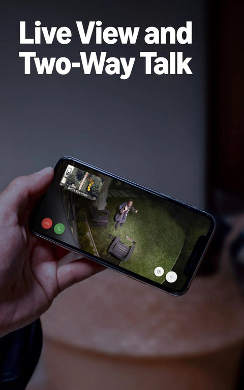 Person using phone to view Floodlight Pro Security Camera With Retinal 2K Video Color Night Vision Two Way Talk And Audio 3D Motion Detection Built In 110 dB Siren Perfect For Home Or Biz Outdoor Security.