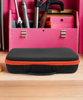 Portable Drill Bit Organizer With EVA Padding on a workbench, black case with reinforced zipper, ideal for electricians, mechanics.