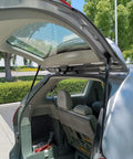 Open rear of car showing Rear Liftgate Lift Supports Set Of 2 For Ford Escape 2001-2012 And Mercury Mariner 2005-2012 Gas Shocks Struts 4370