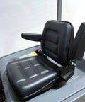 Heavy Duty Electric Pallet Stacker seat with cushioning, armrests, and control panel, designed for comfort and durability.
