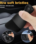 Using boar hair brush from 8 Piece Car Detailing Kit With Boar Hair Brushes Ultra Soft Duster Microfiber Cloths Reusable 160g Cleaning Gel And Portable Organizer Bag For All Rides to clean car interiors, dashboard, and vents.