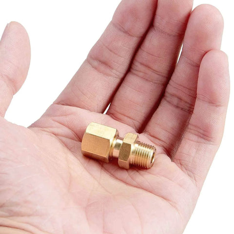 Brass compression straight tube fitting with 1/4 in tube OD to 1/4 in NPT male, in hand