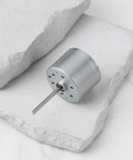 5.9V RF-310T-11400 Mini DC Motor Shaft Length 22mm and Diameter 24mm on white surface