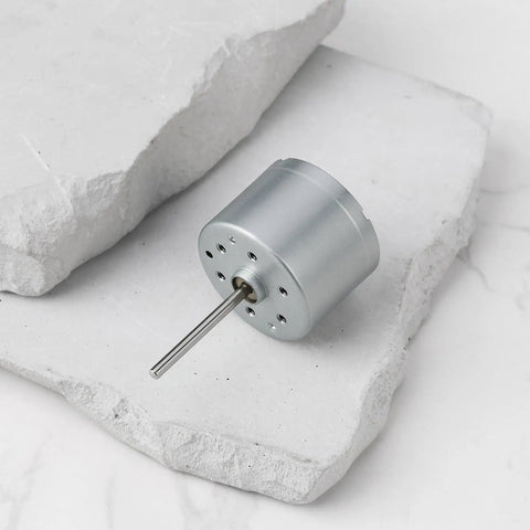 5.9V RF-310T-11400 Mini DC Motor Shaft Length 22mm and Diameter 24mm on white surface
