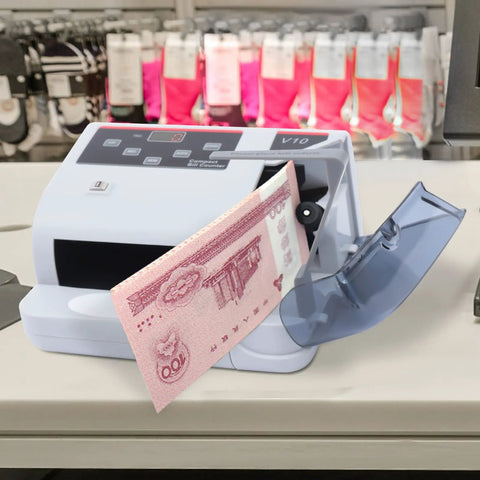Fast Money Counter With LCD Display And Counterfeit Detection, UV MG IR Authentication, counting pink banknote in store.