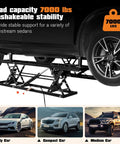 Portable Car Lift 7000 Lbs Heavy Duty Quick Jack With 28 Inch Max Height Locking Levers And Wheels holding a sedan in garage use
