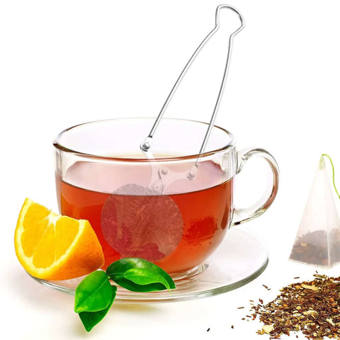 Glass teacup with Stainless Steel Tea Infuser Ball Strainer With Handle 3 Pack Ultra Fine Mesh Filter, orange slice, and tea leaves