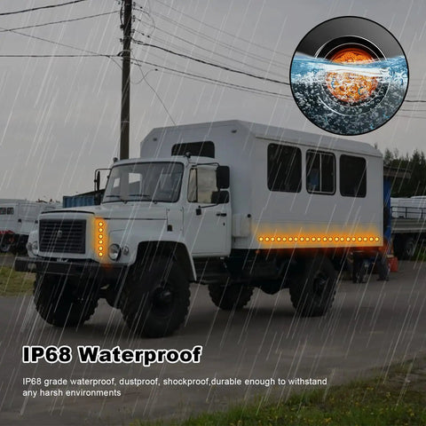 Amber 2 Inch Round Sealed LED Clearance Marker Light Kit With 9 Bright LEDs on a truck in rain
