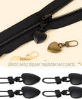 Two Piece Black Heart Shaped Zipper Pull Replacement Kit For Luggage Backpacks Jackets Coats Boots And Clothing Durable Metal Zipper Pulls With Universal Fit For Quick Slider Fix And Easy DIY Repair - black and gold heart shaped pulls displayed with zipper