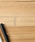 Upgrade Your Pens With A 40pc Ballpoint Pen Spring Kit Made From Durable Stainless Steel For Smooth Writing, Quick Refill Replacement And Total Comfort So You Can Write Fast Like A Boss At School Or Work Today. stainless steel pen spring beside black ballpoint pen on wood