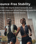 Two runners wearing Dyna LT Womens Running Hydration Vest With Hydraulics Soft Flasks, Black Medium, in urban setting