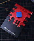 Red and blue Dope Precision Mini Photo Etched Parts Bender For Model Kits And Miniatures Metal Tool Set on grid mat