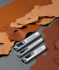Pro Grade Leather Punch Set With Steel Hollow Punches, Three Piece Grommet Hole Punch Kit, tools on brown leather sheets