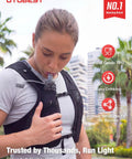 Person using No Bounce Hydration Vest Pack For Men And Women With 500ml Soft Flask, showing convenient drinking feature.