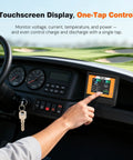 Person using touchscreen display on All In One 48V LiFePO4 Golf Cart Battery Upgrade Kit with 56.8V Charger in golf cart.