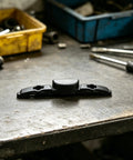 Luggage Repair Button And Replacement Pull Handle Fix Broken Suitcase Grips With Ease Solid Black Plastic on workshop table.