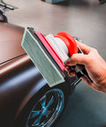 Pneumatic Palm Sander Kit With Random Orbital Action For Auto Body, Car Waxing And Woodworking in use on a car surface