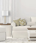 Paloma Table Lamp By Novogratz X Globe in living room with modern glam cutout metal body, matte brass finish, white fabric shade