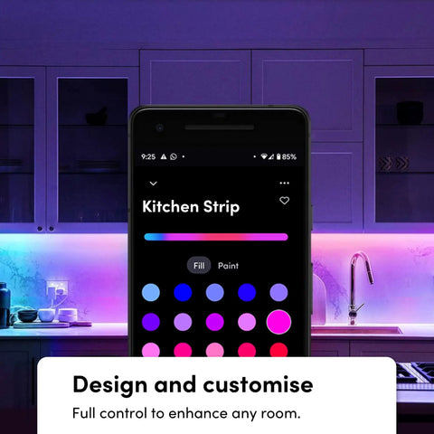 Smartphone controlling Six Point Six Feet Dope Smart LED Strip Lights Kit with multizone RGB in a kitchen setting.