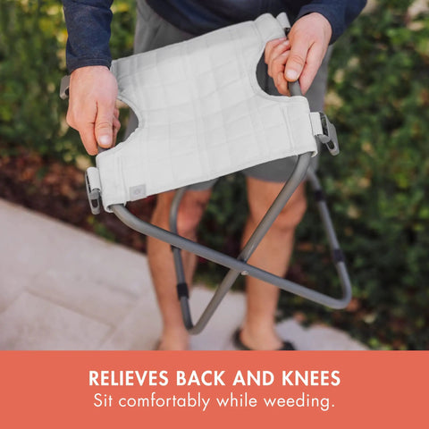 Person holding Gardener Two Point Zero Folding Seat With Tools All In One Portable Garden Stool, Fog Gray