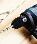 Black 1/4 Inch Hex Shank Keyless Drill Chuck Quick Change Adapter Converter for Impact Drills, installed on drill with bit
