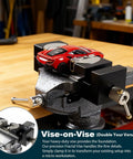Beefy Heavy Duty Multi Material Workbench Vise With Universal Clamping holding a red model car on a workbench, showcasing versatility.