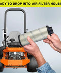 Person holding air filter with lawn tractor in background for Go To Outer And Inner Air Filter Kit For Kawasaki And Kohler Engines