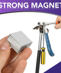 Ultra Strong Neodymium Square Magnets Pack Of 6 1.16 Inch Square By 1/8 Inch Thick Rare Earth Fridge Magnets in hand and near tools.