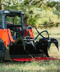 Skid steer with 72 Inch Manure Tine Grapple Bucket Attachment With SSQA Hay Spear Frame And Double Grapple Rake Arms outdoors