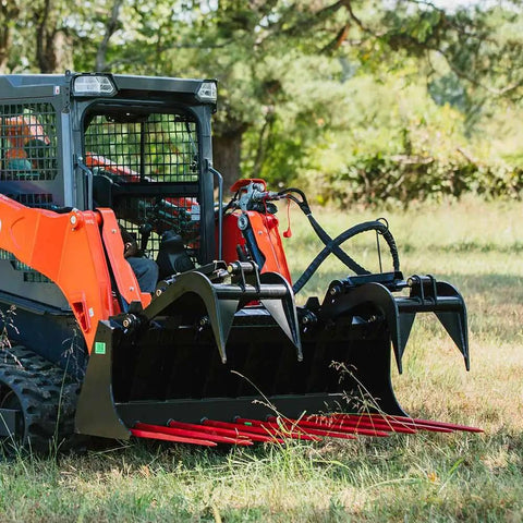 Skid steer with 72 Inch Manure Tine Grapple Bucket Attachment With SSQA Hay Spear Frame And Double Grapple Rake Arms outdoors