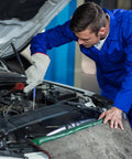 Man in blue coverall using Hella Tough Dual End Metal Scribe Set With Straight Hook And Angled Picks for precise marking in automotive engine.