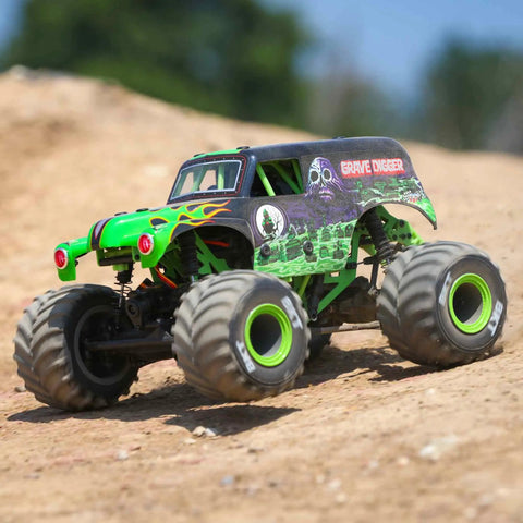 Grave Digger 1 To 18 Scale Mini LMT 4X4 RC Monster Truck RTR with green body and LED headlights on dirt terrain