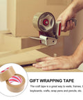 User sealing a box with 2 Pack Kraft Paper Packing Tape Water Resistant Sealing Tape for Shipping and Home Use Hand Tearable Brown Box Tape