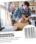 Man using Heavy Duty Five Piece Manganese Steel Woodworking Scraper Kit on wood, demonstrating professional polishing techniques.