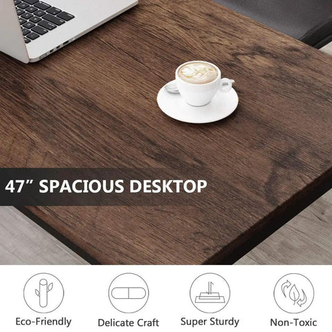 Close-up view of 47 Inch Modern Rustic Computer Desk With Metal Legs And Adjustable Feet, featuring a wooden top and coffee cup.