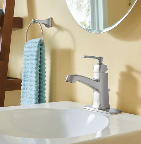 Retreat Collection Brushed Nickel Bathroom Hand Towel Ring With Wall Mount Hardware next to modern faucet and mirror