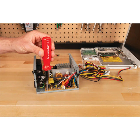 Hella Grippy Heavy Duty Red Handle Six In One Quick Change Multi Bit Screwdriver With Dual Nut Drivers And Phillips Bits being used on electronics.