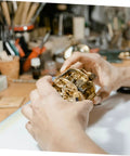 Grandfather Clock Weight Replacement Hook For DIY Restoration Projects with Rock Solid Design in hands of a clockmaker