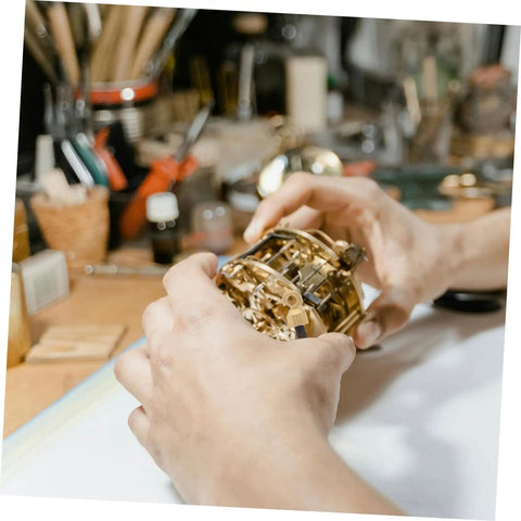 Grandfather Clock Weight Replacement Hook For DIY Restoration Projects with Rock Solid Design in hands of a clockmaker