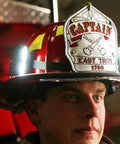 Firefighter wearing Helmet Strap Mount Accessory With Two Magnetic Mounts And Screw In Feature For Hard Hats And Fire Safety Helmets