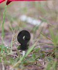 Screw-In Wire Insulators For Wood Posts Sun Resistant 51 Pack With Socket Tool, Tough As Nails Electric Fence Clips For Cattle Fencing, Rainproof And High Holding Power For Large Farms, black insulator installed on ground stake