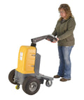Heavy Duty Electric Powered Tugger With 3000 Lb Pull Capacity featuring ergonomic handle and wheels for easy maneuvering in warehouses.