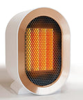 Portable 1200W Ceramic Space Heater For Desk And Home, fast quiet heating, front view of compact white personal heater in use