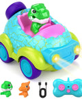 Dinosaur Themed Toddler Remote Control Car With Lights And Music Rechargeable RC Vehicle For Ages 2 3 4 Includes Detachable Dinosaur Figures Colorful Egg Shaped Toy Perfect Birthday Gift For Boys And Girls. Image shows a blue and green remote control car with a green dinosaur figure, pink seat, remote control, USB cable, and orange dinosaur figure.
