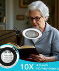 Woman reading a book using a 10X Magnifying Floor Lamp With Light And Stand 3 In 1 Hands Free Loupe, adjustable height from 31.5 to 70.9 inches.