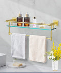 Pro Grade 20 Inch Wall Mount Glass Shelf With Towel Rack In Brushed Gold Finish displaying toiletries and towels in bathroom setting.