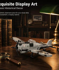 FW-190 Fighter Aircraft Build Kit With 503 Pieces For Adults And Hobbyists displayed on a wooden desk with books and lamp