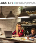 Woman and child in kitchen with soft lighting from A15 LED Bulb 7W 600 Lumens 3000K Soft White 40W Equivalent Dimmable Enclosed Fixture