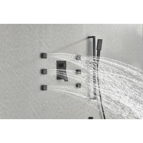 Wall Mounted Shower System with 6 Body Sprays and Hand Shower spraying water from multiple angles on a marble wall.