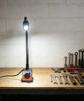 Heavy Duty Led Magnetic Work Light With Flexible Gooseneck Lamp Providing 550 To 650 Lumens on workbench with tools.